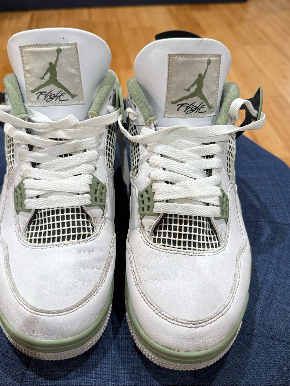 Nike Air Jordan 4 Retro 'Seafoam' sneakers in white and oil green.